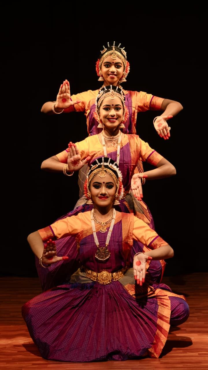 Bharathanatyam dancers presenting a coordinated stage formation
