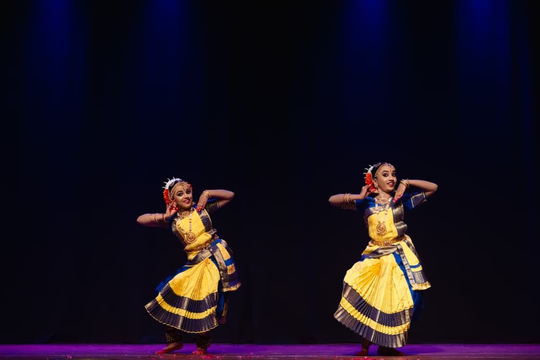 Two dancers demonstrating expression and rhythm on stage